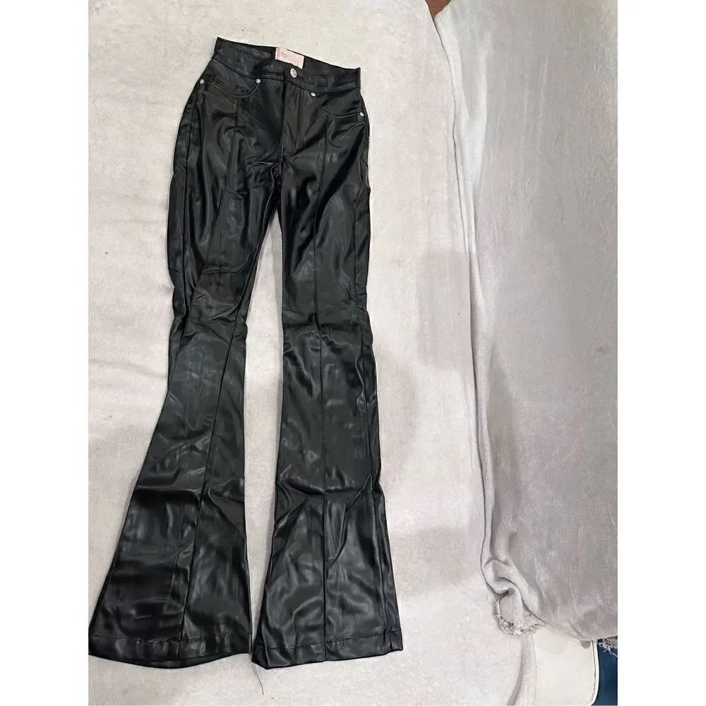 REVICE size 24 black leather pants women’s with huge star on the back